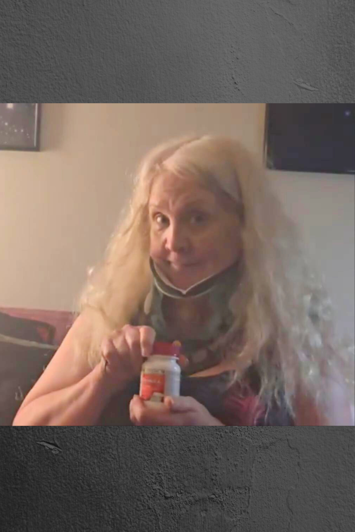 Sandy Eulitt recovering from ACDF and PCDF cervical spine surgery, wearing a cervical hard collar and holding a bottle of Tylenol Muscle Aches & Pains to manage post-surgery pain without prescription pain killers.